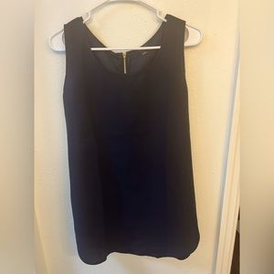 Ann Taylor. Navy shell with gold back zipper and leather cover.    Size L